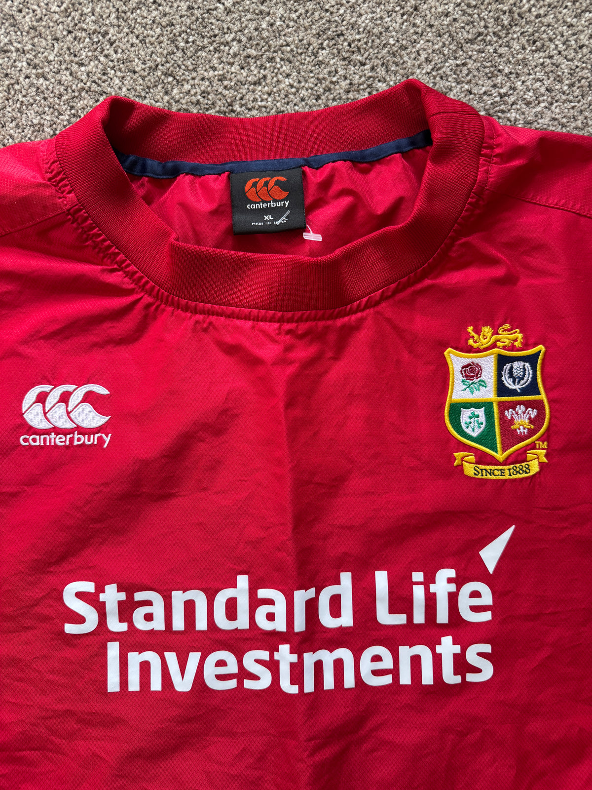 Extra large Canterbury Red 2017 Lions Rugby Training Top belonging to Peter O'Mahony